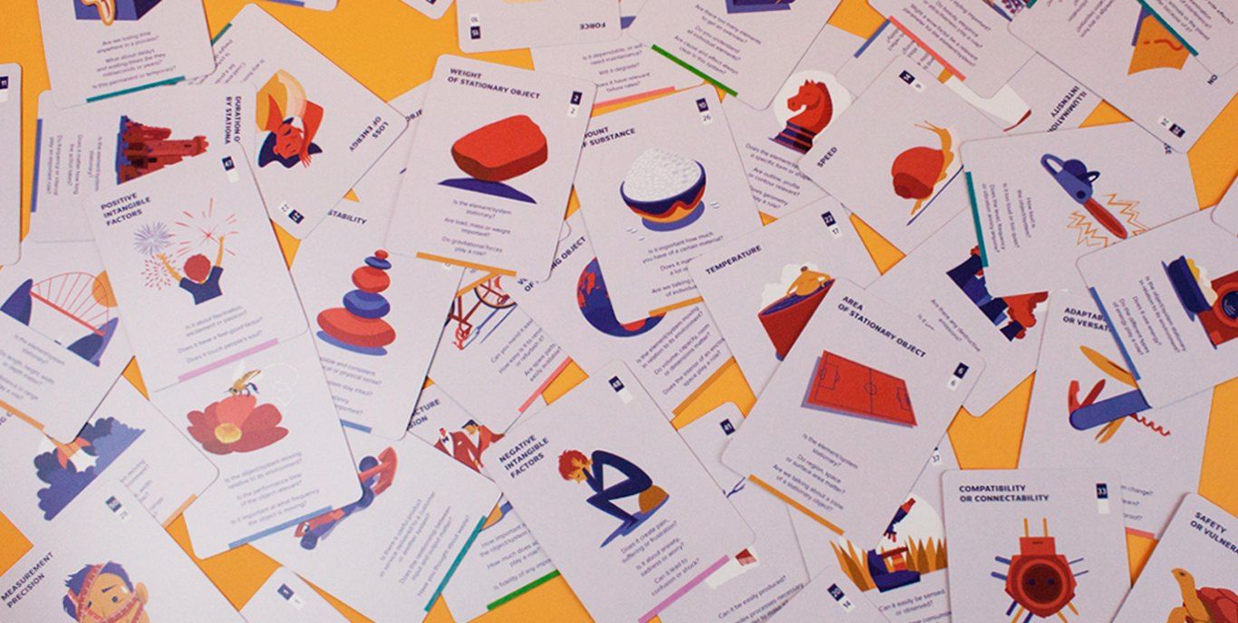 Game of Conflicts playing cards spread out on the table