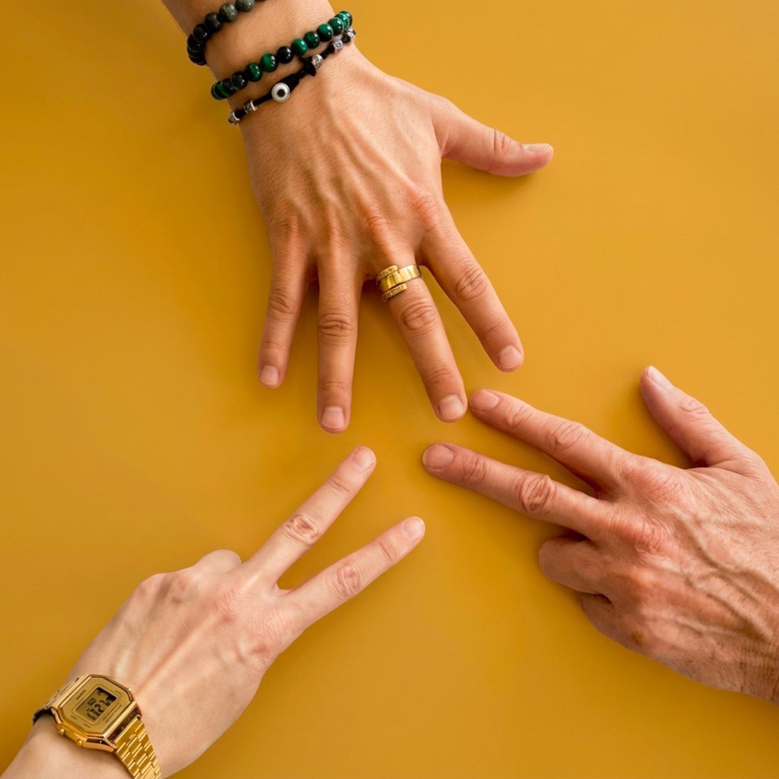 Three players showing numbers with their fingers to prioritize conflicts
